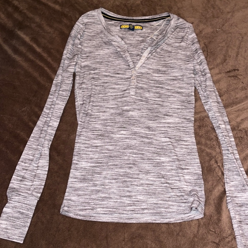 Grey long sleeve shirt .